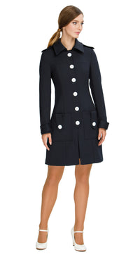 Discover our Fitted Sixties Style Coat, a timeless addition to your outerwear collection. This coat showcases a uniformed aesthetic with impeccable panel craftsmanship and eye-catching decorative button torso closure. Featuring deep front waist-level pockets, a slight flair, and decorative button-down shoulder tabs; it seamlessly combines style and functionality.