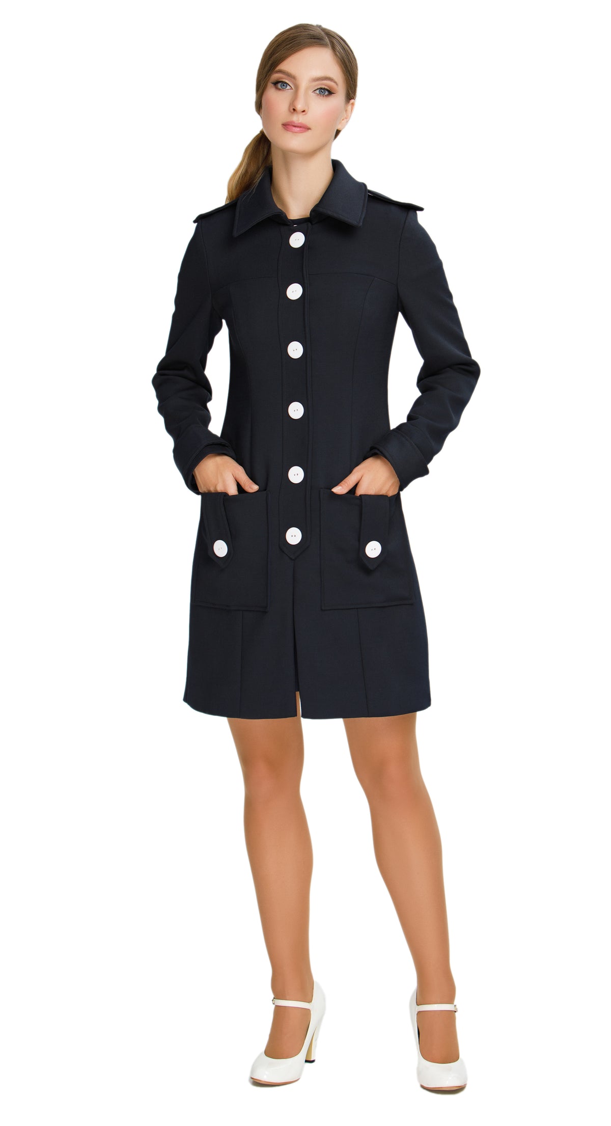 Discover our Fitted Sixties Style Coat, a timeless addition to your outerwear collection. This coat showcases a uniformed aesthetic with impeccable panel craftsmanship and eye-catching decorative button torso closure. Featuring deep front waist-level pockets, a slight flair, and decorative button-down shoulder tabs; it seamlessly combines style and functionality.