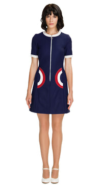 Step back in time with our sixties style, Autumn Dress with Two-Tone Half Circle Pockets; a playful nod to retro fashion that's perfect for any season. This dress captures the essence of the era through its color palette, charming detailing, and delightful playfulness. The front looped zipper closure adds a touch of authenticity, while the short sleeves and traditional rounded neck maintain the timeless appeal.