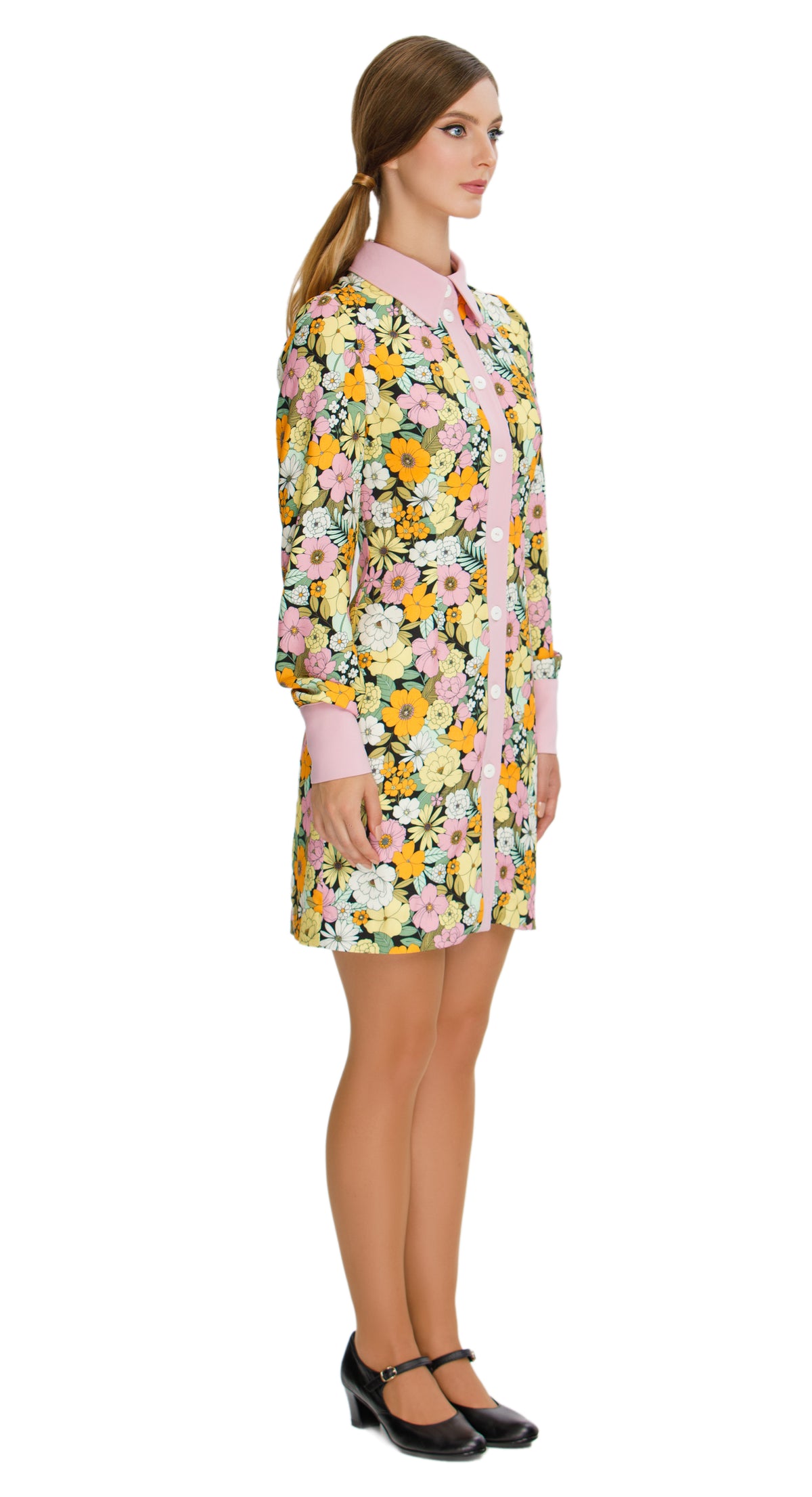 Vibrant Floral  Autumn Shirt Dress; a versatile and delightful addition to your wardrobe. This dress features a vibrant floral pattern that adds a casual elegance to your ensemble, making it perfect for both work and play. The classic pink collar, cuffs, and button down detailing provide a charming contrast against the floral backdrop.