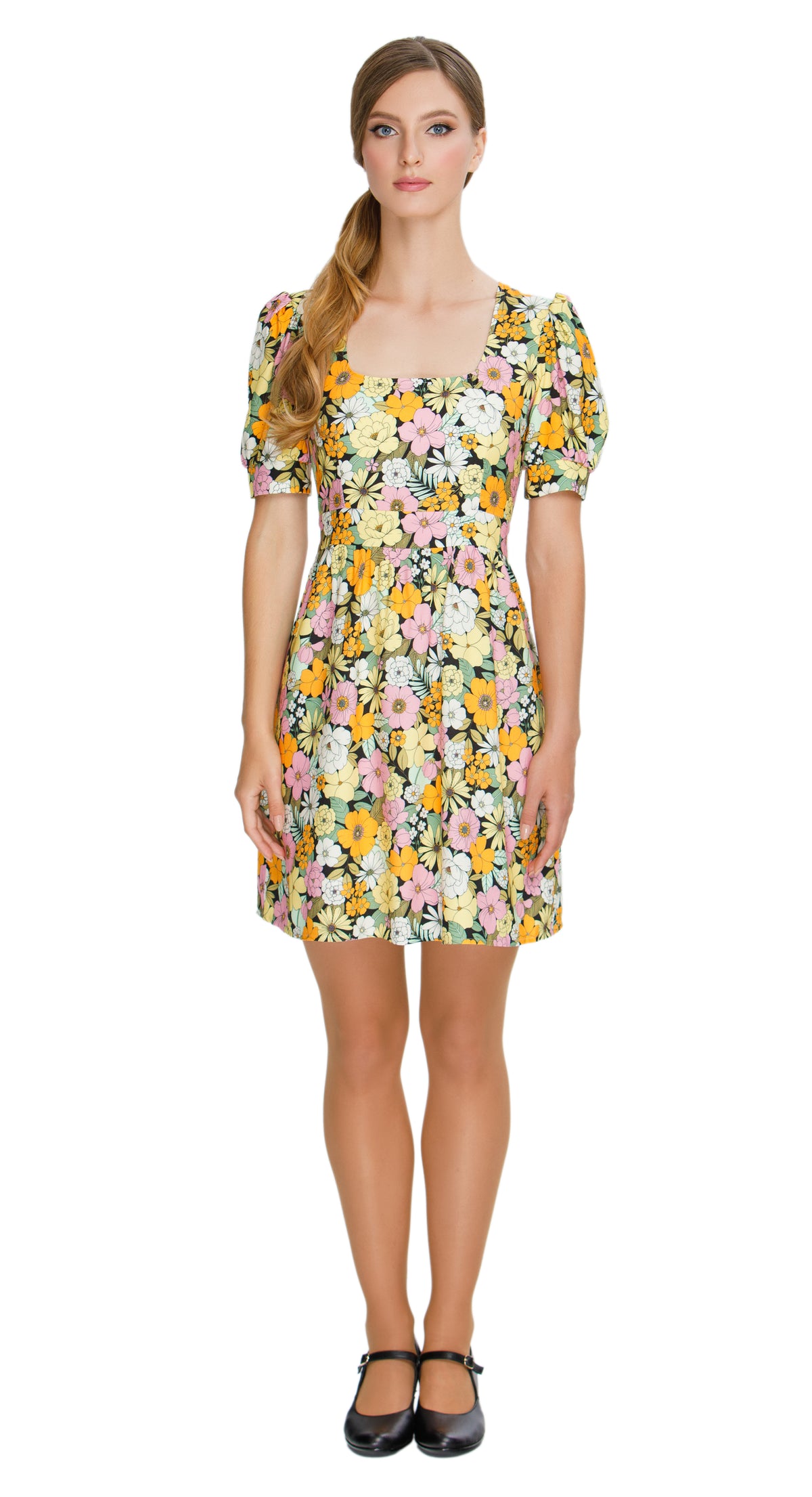 Embrace the essence of autumn with our Floral Autumn Sixties style, work or play dress; a stunning and immediately charming addition to your wardrobe. This dress features a deep square neckline, short slightly puffed sleeves, a gathered waist, and a subtle flair to the skirt, capturing the classic sixties silhouette. The vibrant floral pattern adds a touch of flair to your look.