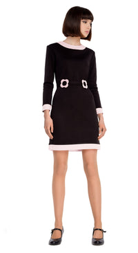 This black medium weight Italian jersey dress, with a punch of cool colour on the collar, trim has a timeless retro feeling aesthetic. A mod sixties style fit, very wearable at work or play. Comfortable jersey provides some stretch.  Finished with 2 buckle belt detail and back zipper. Available in black/red as well as black/light cream jersey.