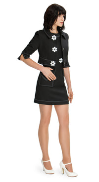 Elevate your wardrobe with our fair weather Cropped Sixties Jacket; an effortlessly confident addition to your style repertoire. This casual piece boasts half-length sleeves adorned with contrasting heavy topstitching, adding a touch of uniqueness. With its fitted waist and playful oversized white flower button detail, this jacket exudes charm and contemporary style.