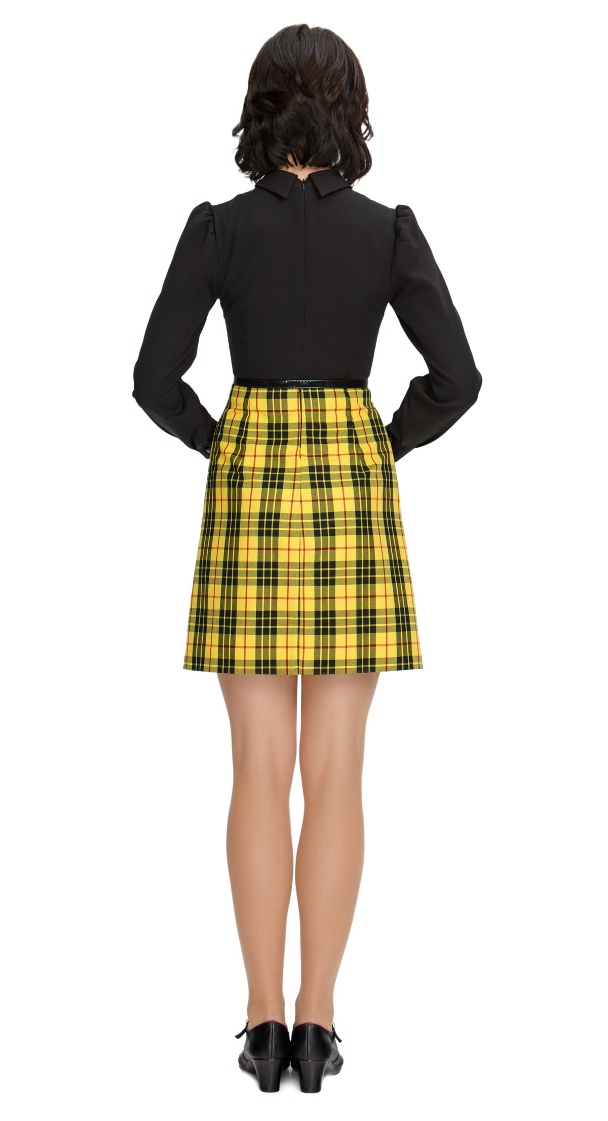 Discover elegance and style in our 70s style, Fitted Autumn/Winter Dress, featuring a plaid skirt paired with a sleek black torso. This dress boasts slightly puffed sleeves, a classic shirt collar, and a thin removable belt for added flair. Elevate your cold-weather wardrobe with this versatile and sophisticated dress, perfect for special occasions or seasonal fashion statements.