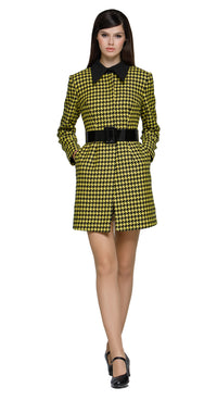 Fitted yellow/black houndstooth fair-weather coat featuring an oversized black buckled belt. A playful twist on a classic pattern, this coat brings bold, contrasting details to the forefront. Perfect for pairing with either our Black/Yellow Houndstooth Dress with Front Zipper Pull or our 60s Style Black/Yellow Houndstooth Skirt from this collection for an effortlessly chic and cool Autumn high-fashion vibe. Invisible snap closure. Made from heritage French mill fabric.