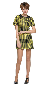Autumn, slightly A-line yellow/black houndstooth, short-sleeve dress with a classic black Peter Pan collar and front pleat. 
Shown here with short sleeves, though alternative sleeve and hem lengths are available. A lively retake on a classic houndstooth look, enhanced by uplifting colors. Made from a French heritage mill fabric.