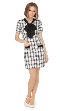 Autumn/winter work-or-play sixties classic cut dress with dramatic black contrasting bow, black contrasting trimmed essentials pockets and short sleeves in a beautiful black and light cream Spanish weave.  Choose bespoke for sleeve and hem length options.  Pairs perfectly with our Retro Style Coat with Detachable Faux Fur Collar and Cuffs to complete the look of this classic set.