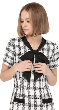Autumn/winter work-or-play sixties classic cut dress with dramatic black contrasting bow, black contrasting trimmed essentials pockets and short sleeves in a beautiful black and light cream Spanish weave.  Choose bespoke for sleeve and hem length options.  Pairs perfectly with our Retro Style Coat with Detachable Faux Fur Collar and Cuffs to complete the look of this classic set.