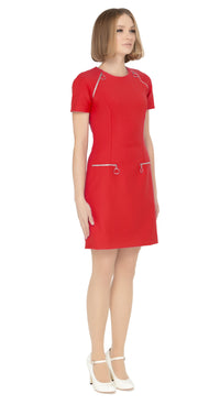 Our stunning fitted sixties dress in knock ‘em dead red. Functional front pockets keeping your hands free and matching retro loop zip shoulder detailing for attentive to style continuity. The short sleeves and rounded neck provide a comfortable and flattering fit.
