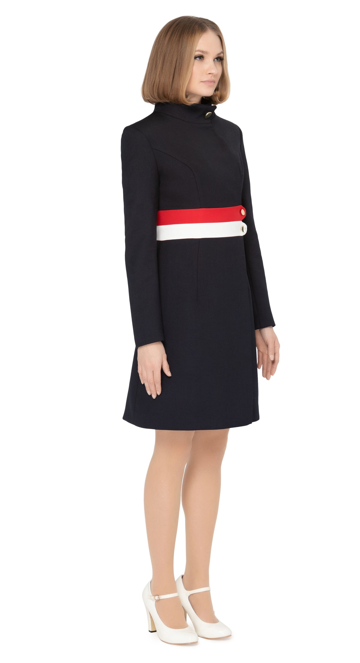 Fitted tricolor fair-weather coat with navy blue as the primary colours leading into light cream and red bands around the waistline. Fully lined with a gold coloured button closure and invisible essentials side pockets.  Pairs well with our Sixties Style Navy/Red/Light Cream Dress to complete a very wearable and versatile high fashion style for all occasions.