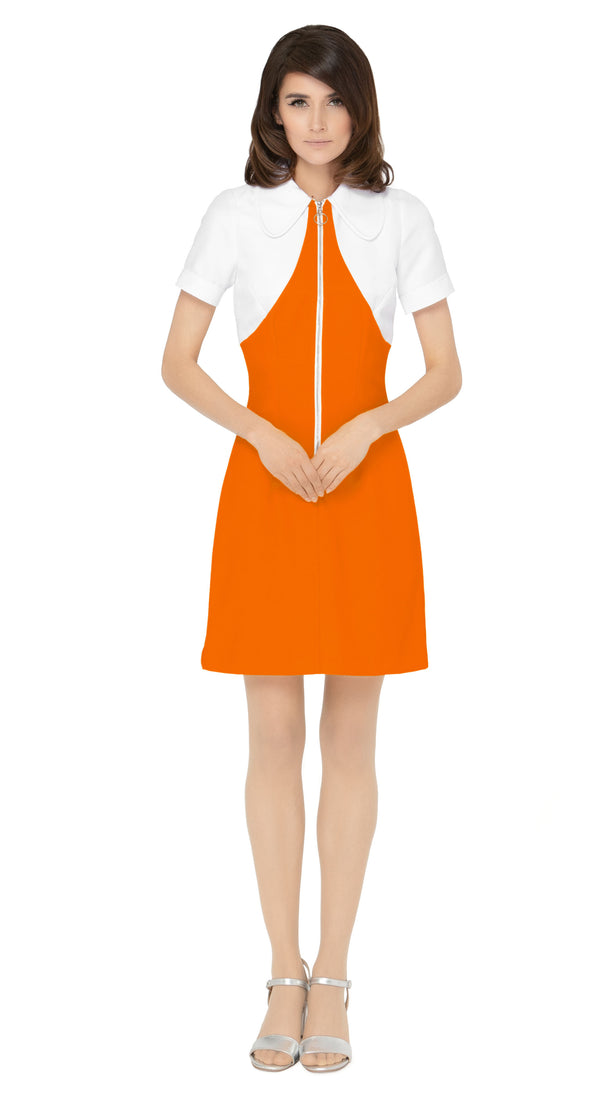 Vintage sport inspired dress; casual, cool and immediately spring. This fitted, slightly A-line dress features a classic oversized 70s style collar and imaginative contrasting paneling across the torso and neckline, giving it a modern twist on European sports styles of the sixties and seventies. The retro looped zipper front closure and short sleeves add to its vintage charm.
