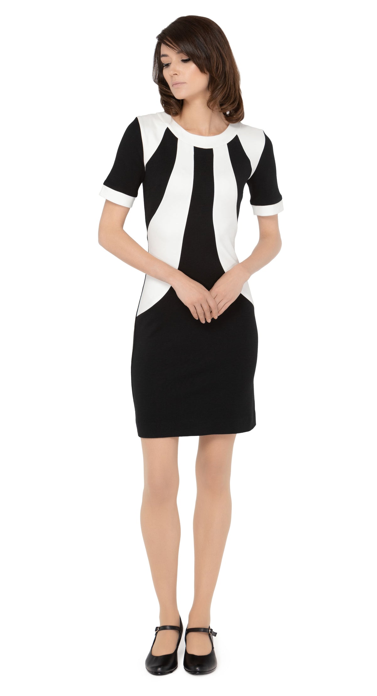 Italian medium-weight fitted wool jersey two tone dress with dramatic Atari detailing across the front torso. Detailing with a classic trim neckline and short sleeves.  Choose bespoke to alternate sleeve and hem length.