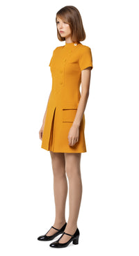 A classic sixties aesthetic; autumn dress with fitted torso, front pleat, a-line skirt, functional pocket, 5 button decorative detailing, stand away collar, beautiful topstitching & short sleeves.  Choose bespoke for any length of sleeve or hem or to alternate colour. Please feel free to contact us for colour availability.