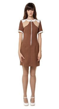 Fitted Autumn dress, drawing on a retro sport feel;  blending the style into a high fashion and very wearable autumn look.  The versatility of this style lends itself as a go-to for both day or night, office or event. A premium Spanish viscose/wool blend fabric, retro looped front zip closure, short sleeves and rounded neckline.  Choose bespoke to alternate sleeve and/or hem length.