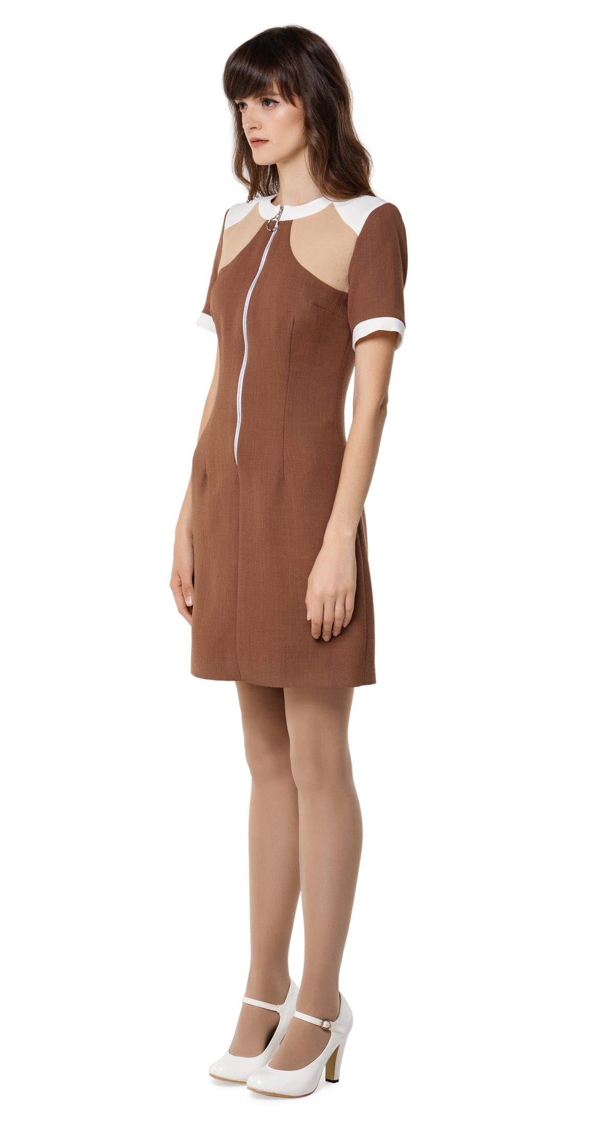 Fitted Autumn dress, drawing on a retro sport feel;  blending the style into a high fashion and very wearable autumn look.  The versatility of this style lends itself as a go-to for both day or night, office or event. A premium Spanish viscose/wool blend fabric, retro looped front zip closure, short sleeves and rounded neckline.  Choose bespoke to alternate sleeve and/or hem length.