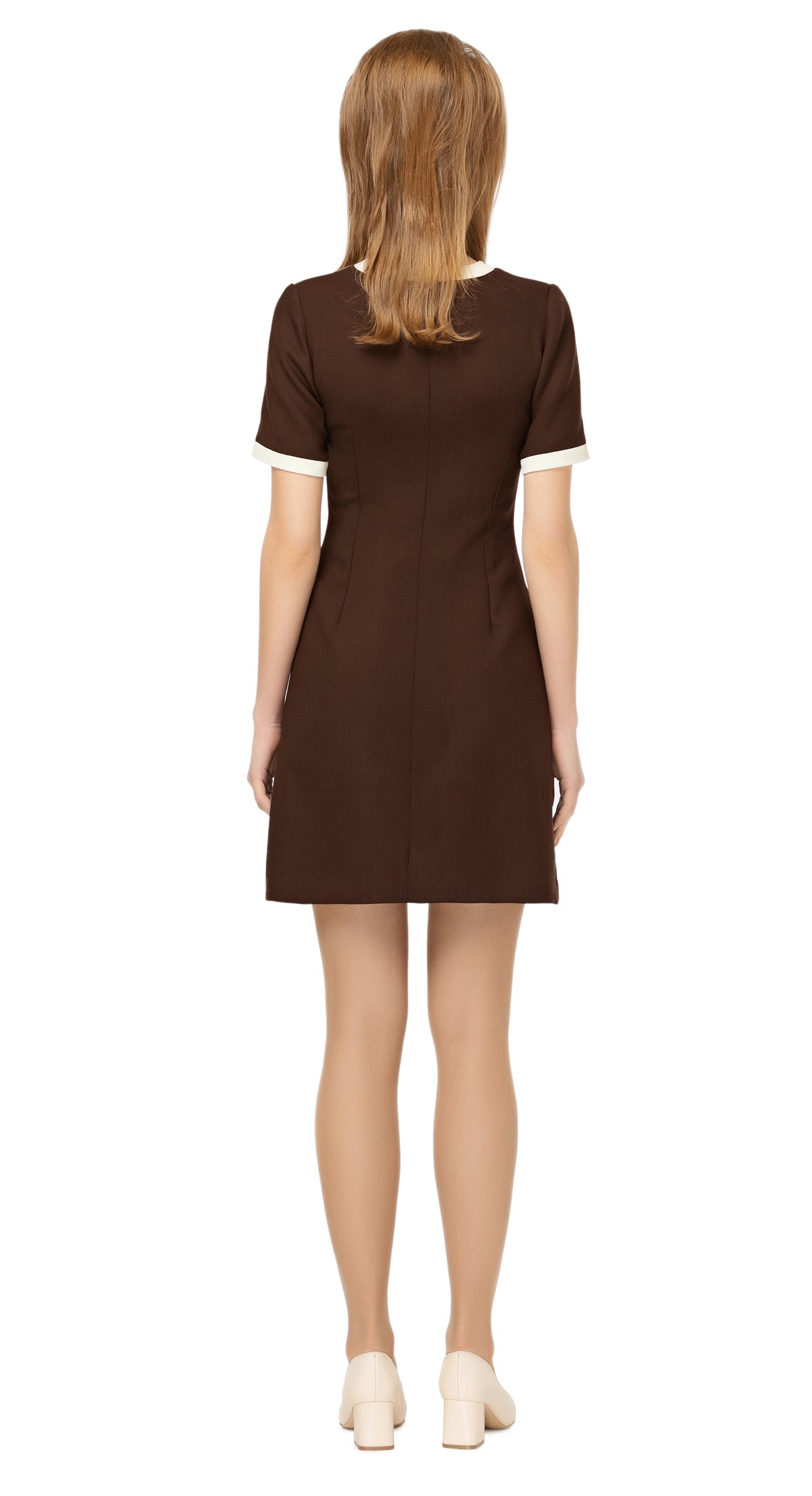Fitted, fair weather dress, drawing on a retro sport feel & blending the style into a high fashion and very wearable Spring look.  The versatility of this style encourages this as a go-to for both day or night, office or event. A premium Spanish wool blend fabric, retro looped front zip closure, short sleeves and rounded neckline.  Choose bespoke to alternate sleeve and/or hem length.  Pairs perfectly as intended with our retro styled cropped Spring jacket.