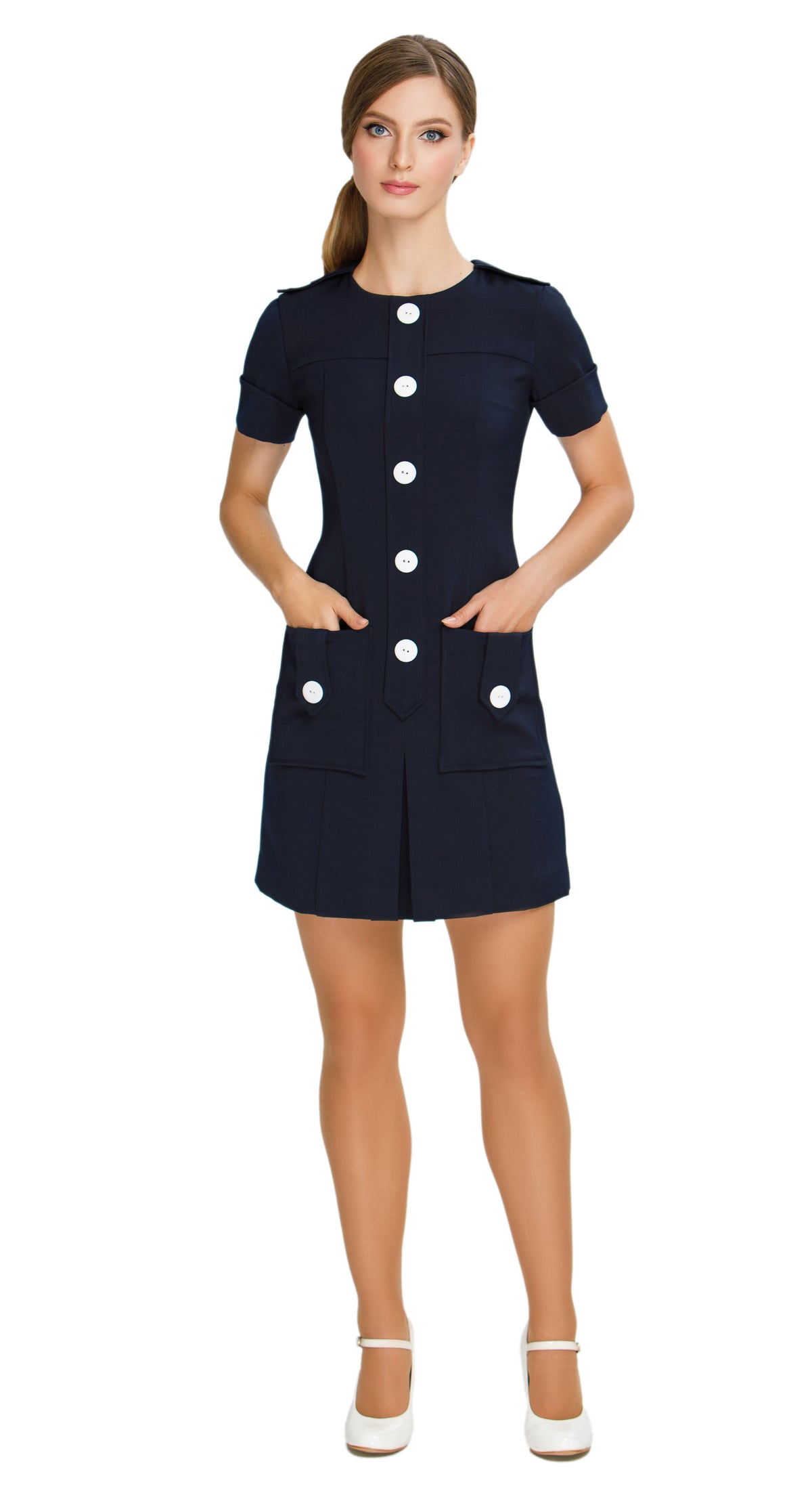 Elevate your wardrobe with our Fitted Sixties Style Dress; perfect for work or play. This dress boasts a uniformed aesthetic, flattering panel craftsmanship, and decorative button torso detailing. With deep skirt pockets, a front pleat, and decorative button-down shoulder tabs, it combines elegance and functionality effortlessly. 