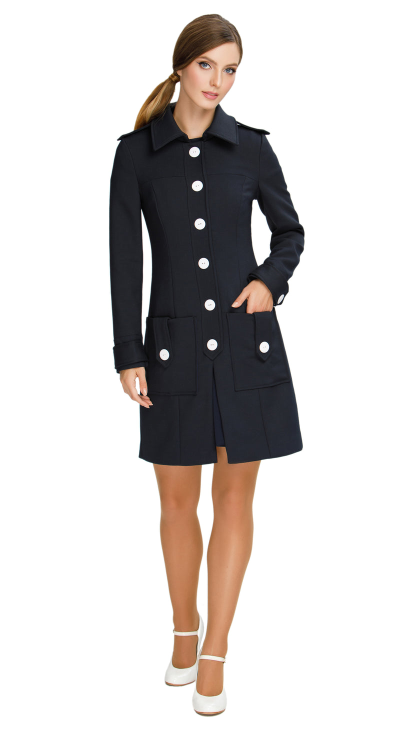 Discover our Fitted Sixties Style Coat, a timeless addition to your outerwear collection. This coat showcases a uniformed aesthetic with impeccable panel craftsmanship and eye-catching decorative button torso closure. Featuring deep front waist-level pockets, a slight flair, and decorative button-down shoulder tabs; it seamlessly combines style and functionality.