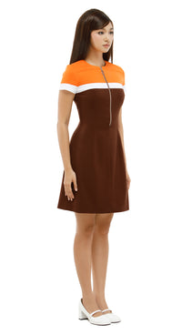 Woman wearing a brown and orange dress on a white background