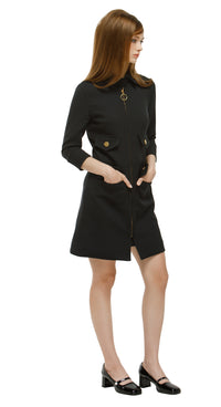 Elevate your wardrobe with this Tailored Sixties-Inspired Black Coat, a perfect blend of vintage charm and modern sophistication. Featuring a refined ’60s silhouette, clean lines, bold topstitching, and a gold ring zipper, this coat delivers timeless elegance. Discreet pockets add functional style for everyday wear.

Pair it with our Timeless Sixties-Inspired Little Black Dress for a coordinated retro outfit, or wear it solo for versatile, day-to-night fashion. Ideal for casual chic, office styling, or even
