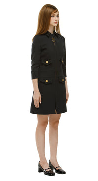 Elevate your wardrobe with this Tailored Sixties-Inspired Black Coat, a perfect blend of vintage charm and modern sophistication. Featuring a refined ’60s silhouette, clean lines, bold topstitching, and a gold ring zipper, this coat delivers timeless elegance. Discreet pockets add functional style for everyday wear.

Pair it with our Timeless Sixties-Inspired Little Black Dress for a coordinated retro outfit, or wear it solo for versatile, day-to-night fashion. Ideal for casual chic, office styling, or even