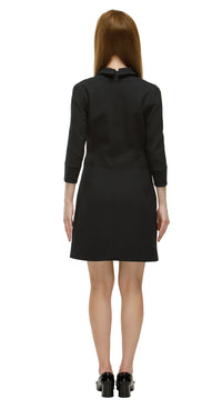 Elevate your wardrobe with this Tailored Sixties-Inspired Black Coat, a perfect blend of vintage charm and modern sophistication. Featuring a refined ’60s silhouette, clean lines, bold topstitching, and a gold ring zipper, this coat delivers timeless elegance. Discreet pockets add functional style for everyday wear.

Pair it with our Timeless Sixties-Inspired Little Black Dress for a coordinated retro outfit, or wear it solo for versatile, day-to-night fashion. Ideal for casual chic, office styling, or even