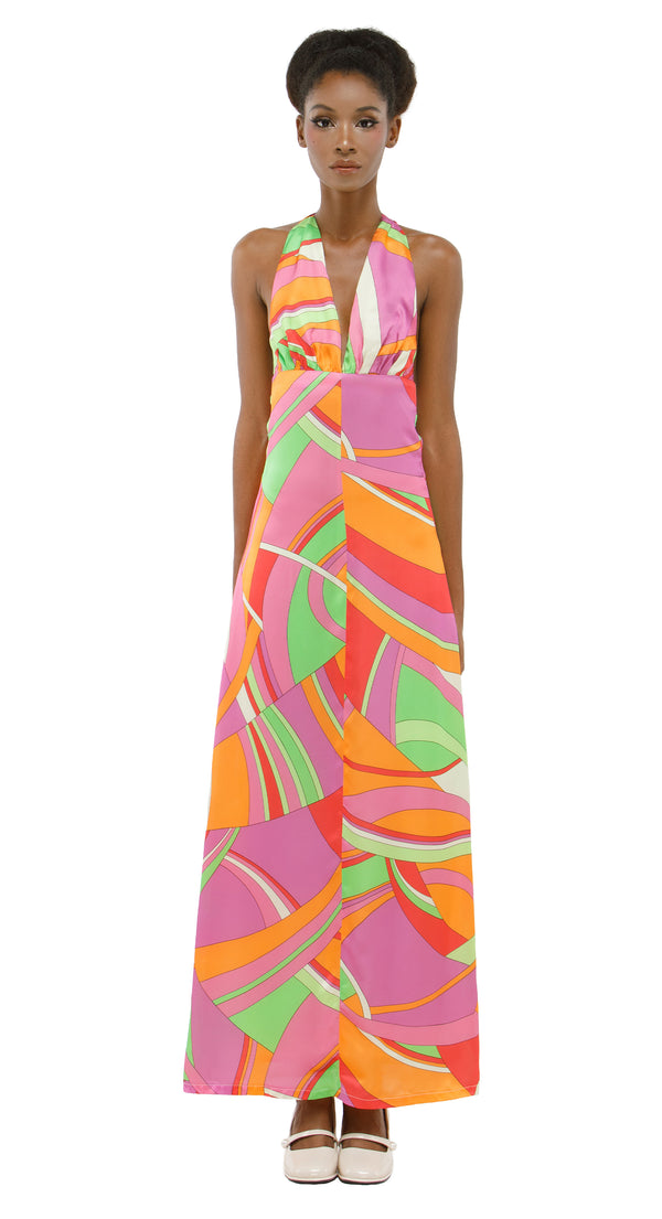 Woman wearing a 1960s Pucci style colorful patterned fabric dress on a white background