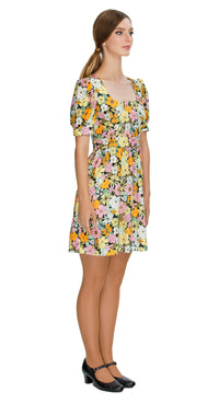 Embrace the essence of autumn with our Floral Autumn Sixties style, work or play dress; a stunning and immediately charming addition to your wardrobe. This dress features a deep square neckline, short slightly puffed sleeves, a gathered waist, and a subtle flair to the skirt, capturing the classic sixties silhouette. The vibrant floral pattern adds a touch of flair to your look.
