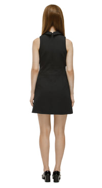 Black sleeveless dress worn by a model on a white background