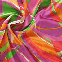 Colorful fabric with multicolored  1960s Pucci style pattern.