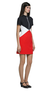 An effortlessly wearable closet go-to; this casual, yet striking 1960s style, tri-colour dress is tailored for both work and play. Crafted in a bold combination of red, dark navy and white; this fitted piece holds timeless elegance with its retro-inspired front zip closure, stand-up collar, and short sleeves, lending itself to any setting. It's thoughtfully designed with discreet front pockets for both style and functionality. 
Available as shown or customizable with alternative sleeve and hem lengths for a