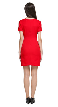 Achieve a confidence-boosting look with this versatile space age style, red fitted dress, designed to flatter all shapes and suit any season or purpose. Featuring imaginative top-stitch detailing, it showcases carpenter-style pockets. A unique circular cut-out design complements the rounded neckline, adding a modern focal point. 
The dress features a rear invisible zipper for a sleek fit and is shown here with short sleeves, though it’s available in mid to long sleeve options and customizable hem lengths. A