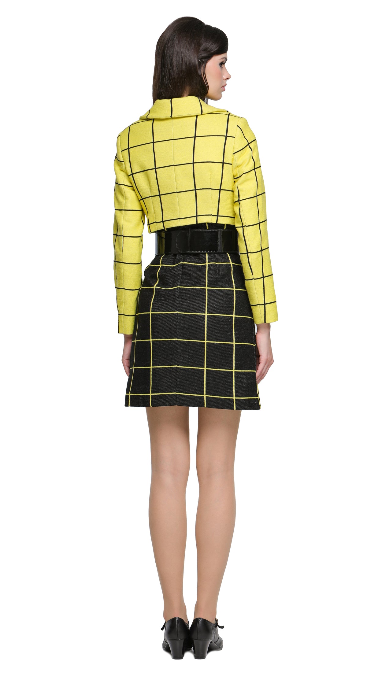 Sixties-style cropped Autumn, yellow and black grid-pattern jacket with a flat, square collar and six black button details. A versatile piece to pair with a plain skirt or pants, but it pairs perfectly with our Black/Yellow Dress with Square Neckline from this collection, offering a chic, wearable option for both leisure and professional engagements. Made from a French heritage mill weave.