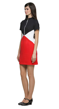 An effortlessly wearable closet go-to; this casual, yet striking 1960s style, tri-colour dress is tailored for both work and play. Crafted in a bold combination of red, dark navy and white; this fitted piece holds timeless elegance with its retro-inspired front zip closure, stand-up collar, and short sleeves, lending itself to any setting. It's thoughtfully designed with discreet front pockets for both style and functionality. 
Available as shown or customizable with alternative sleeve and hem lengths for a
