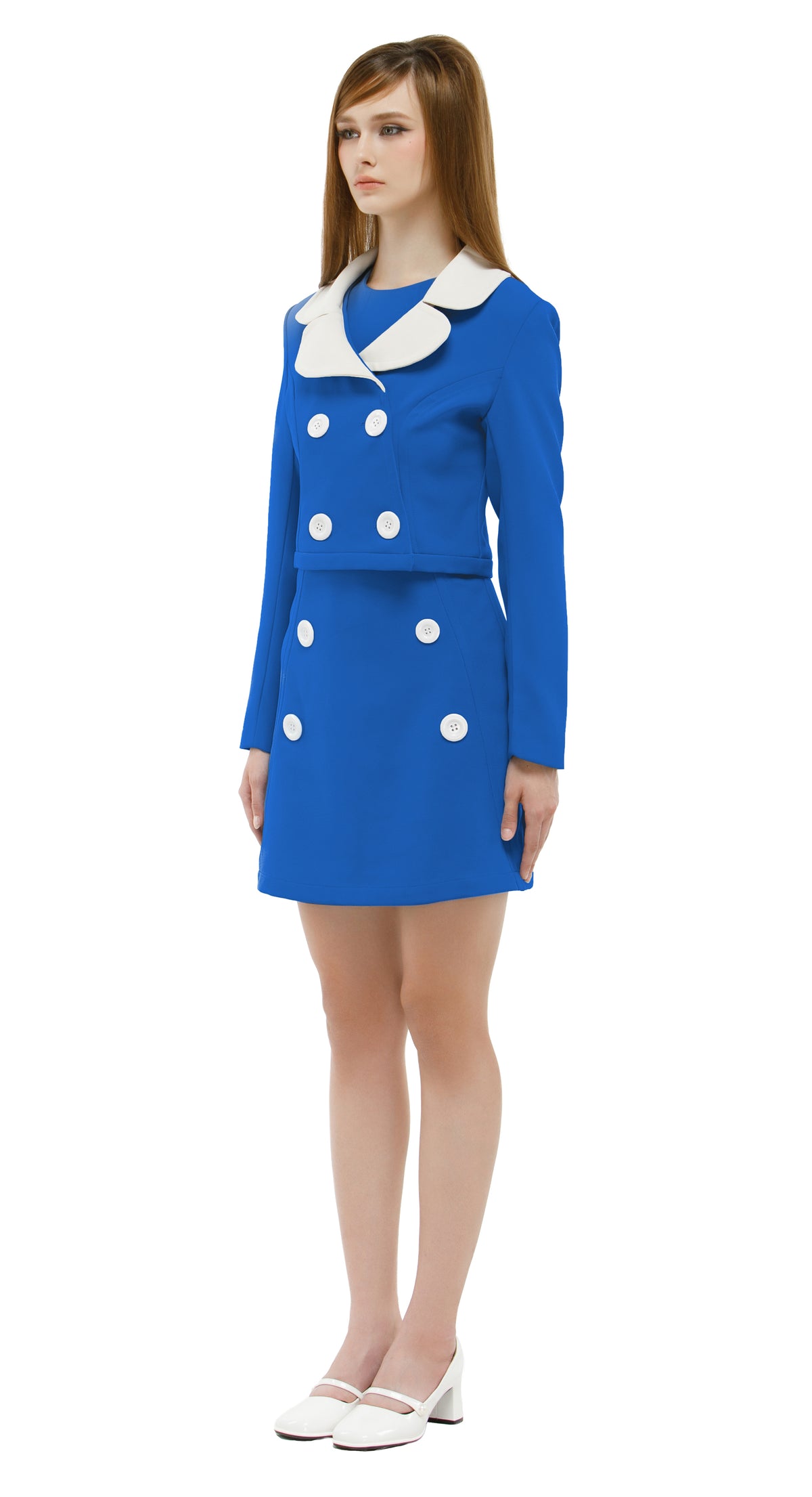Woman wearing a blue/white mod 1960s dress and jacket on a white background