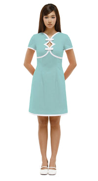 Woman wearing a  mint green, Mod 1960s style dress with white accents, 2 diamond cutouts and 2 small bows on a white background