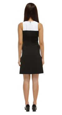 Woman wearing a black and white dress on a white background