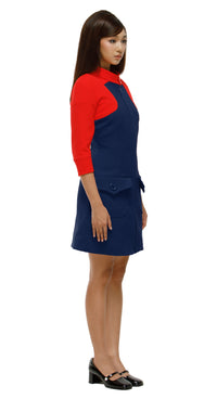 Woman wearing a red and blue dress on a white background