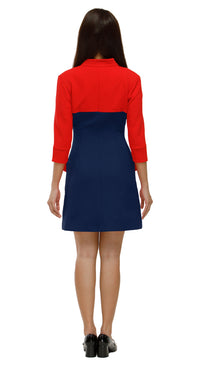 Woman wearing a red and blue dress on a white background