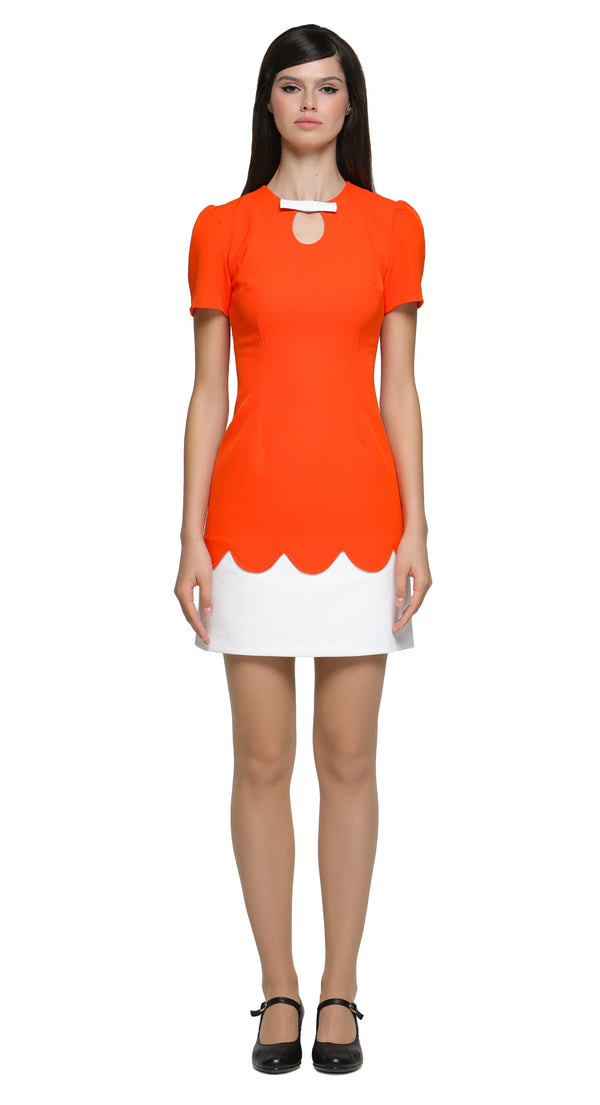 Achieve an easy to reach for stunning look with this fitted vibrant retro event dress, featuring subtle white bow detailing over a neckline cutout. The bold orange torso leads to beautifully crafted top-stitch finished scalloped detail, complemented by a short white skirt. This versatile piece suits heels for an elegant night out but also lends itself perfectly to flats and kicks for a more casual vibe.
Available in alternative sleeve and hem lengths, as well as a variety of colors, this dress is designed t