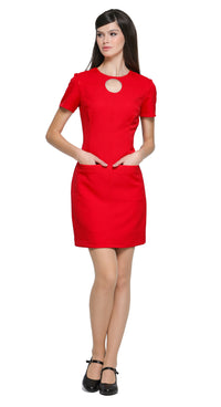 Achieve a confidence-boosting look with this versatile space age style, red fitted dress, designed to flatter all shapes and suit any season or purpose. Featuring imaginative top-stitch detailing, it showcases carpenter-style pockets. A unique circular cut-out design complements the rounded neckline, adding a modern focal point. 
The dress features a rear invisible zipper for a sleek fit and is shown here with short sleeves, though it’s available in mid to long sleeve options and customizable hem lengths. A