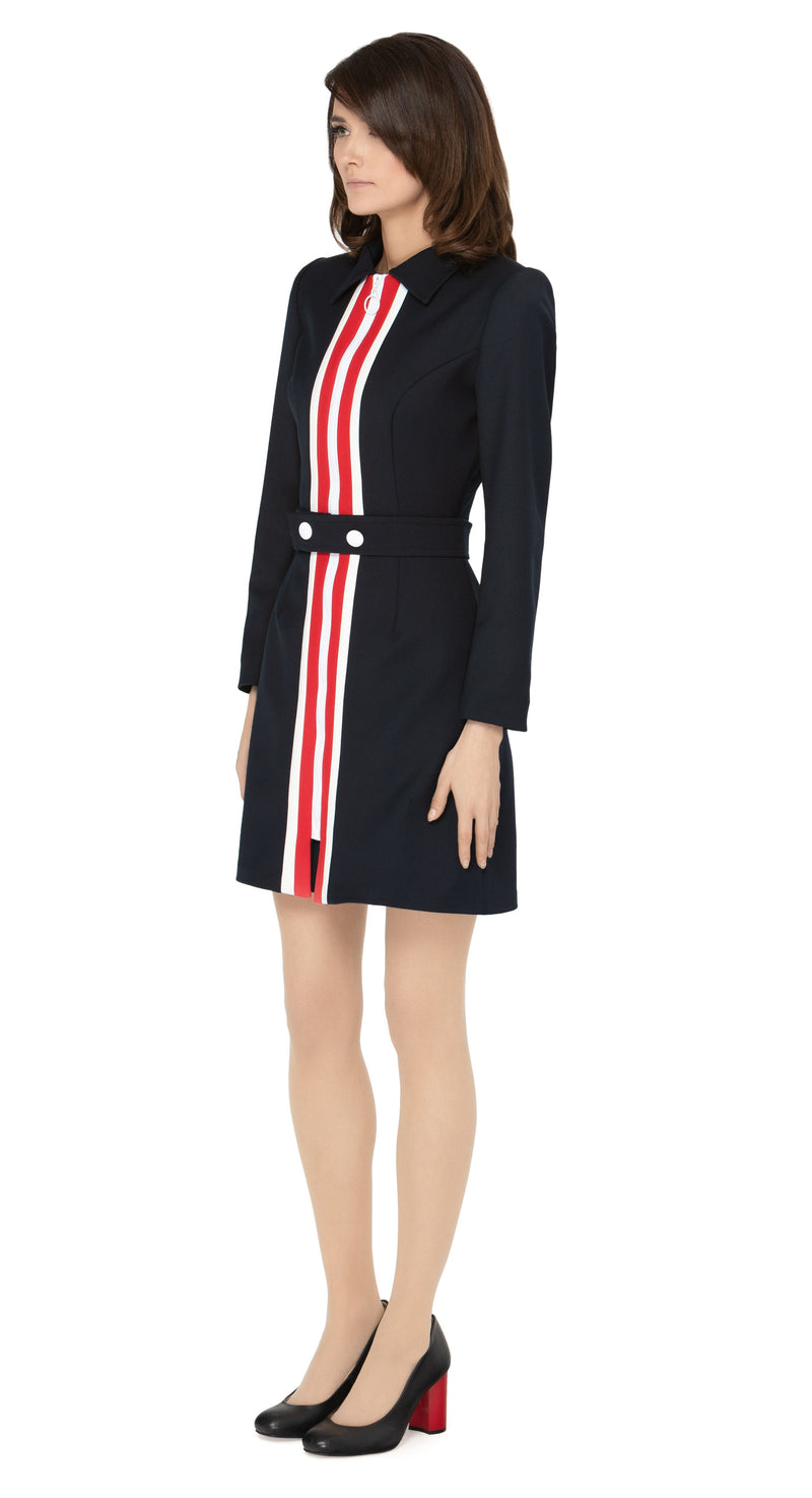 Our fitted sixties style meticulously tailored coat reflects a timeless aesthetic and elevates the simplicity with an imaginative waist level belt, button detailing and striking contrasting colour neck to hem lines. The retro loop front zipper closure purposely remains within the retro theme, making this coat a true classic.