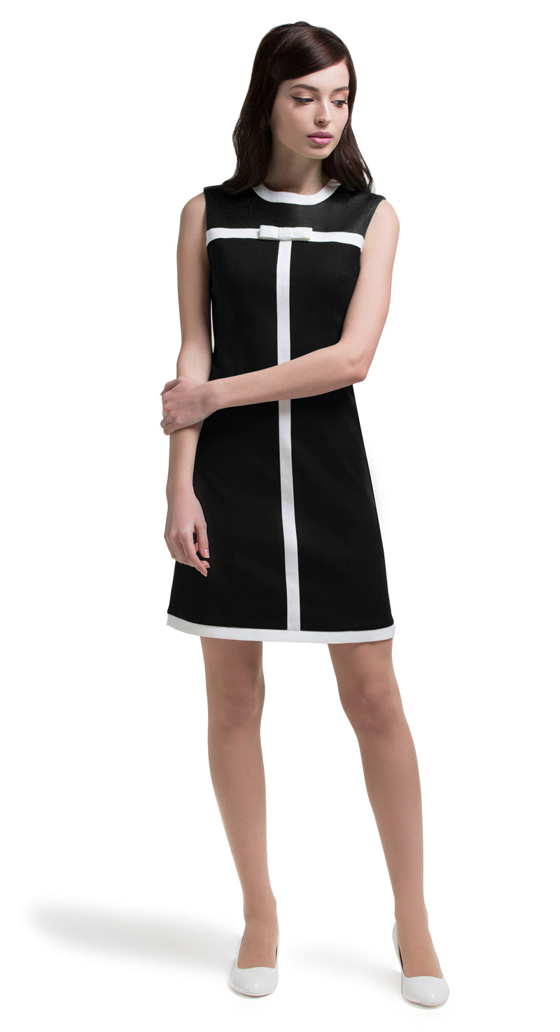 This slightly a-line Italian cotton dress has casual elegance and makes a confident cool immediate impression. The vintage aesthetic allows for the front top panel to work in a variety of colours complementing the dress whether opting for original black, contrasting red and black or contrasting green and black. Choose the bespoke option if you prefer sleeves or different colours.