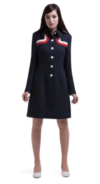 Another immediately sixties mod Autumn coat that allows for the timeless tri-colour of navy blue, red and light cream to produce a dramatic silhouette. A straight cut featuring a classic collar, fully lined Italian mill fabric, with functioning side pockets, animated white button front closure and a cool retro striped neckline.  An entrance maker over plain dresses within the tricolour colour range or paired perfectly with matching dress to complete this high fashion very wearable set.