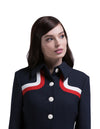 Another immediately sixties mod Autumn coat that allows for the timeless tri-colour of navy blue, red and light cream to produce a dramatic silhouette. A straight cut featuring a classic collar, fully lined Italian mill fabric, with functioning side pockets, animated white button front closure and a cool retro striped neckline.  An entrance maker over plain dresses within the tricolour colour range or paired perfectly with matching dress to complete this high fashion very wearable set.