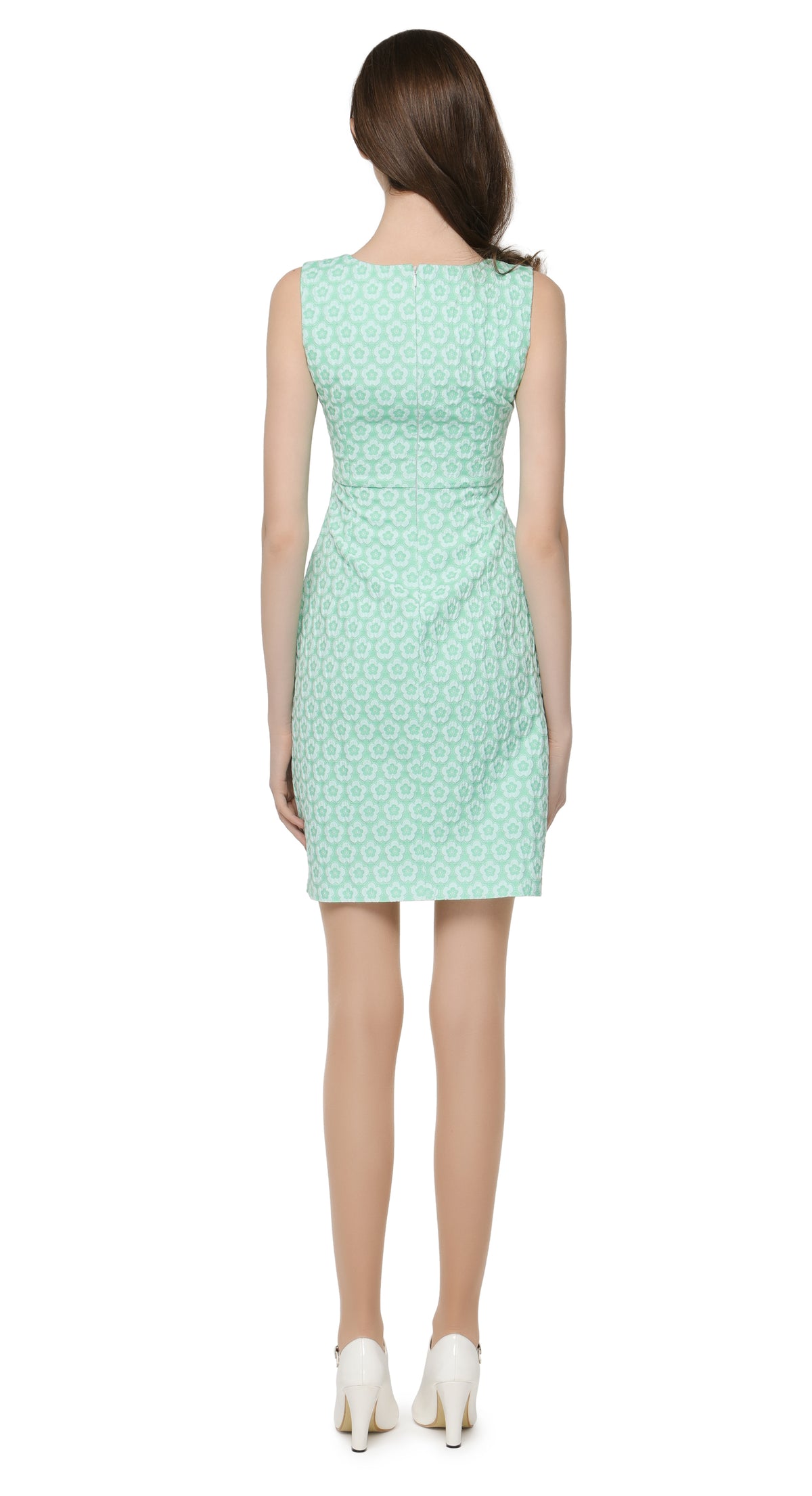 Mint green spring outing dress with matching covered button decoration below a curved v-neckline.  A stunning French jacquard fabric lends itself perfectly to an immediately feminine silhouette and a classic, easy to wear entrance maker.  Choose bespoke for custom measurements, to add short or capped sleeves and/or amend hem length.