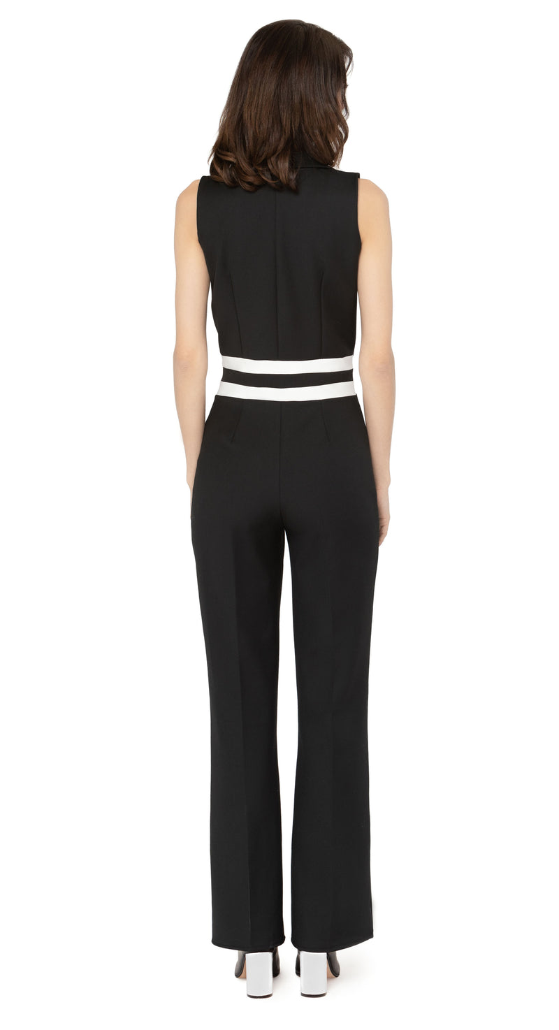 Introducing our spring 1970s style jumpsuit; an easily adaptable from work to play style, featuring waist level stripe detailing. This Italian stretch fabric is very comfortable with an aesthetic that can be worn casually or as a revised approach to what is a professional style for the warmer months.