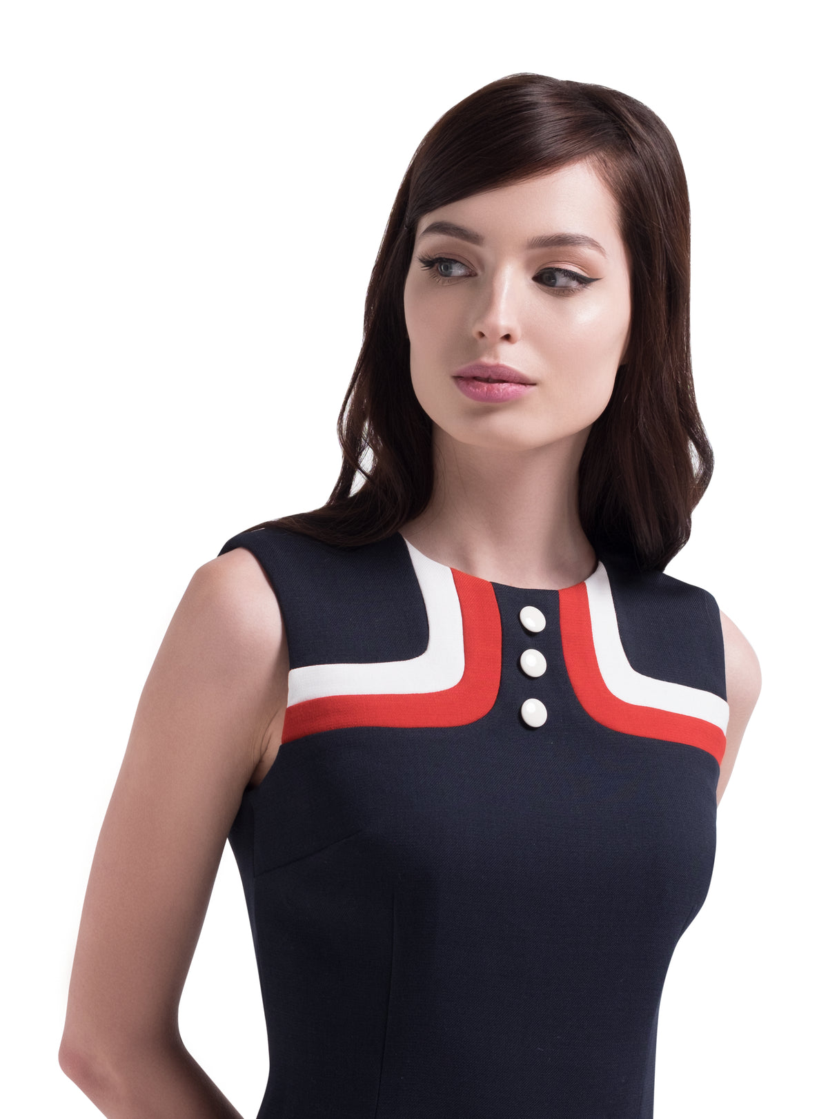 This straight cut mod style sleeveless dress has distinguished tricolour bodice detailing, three neckline buttons and a thick light cream coloured waistline belt. Italian fabric, fully lined. A versatile wardrobe addition for at-work or play. Pairs perfectly with our matching coat to complete a casual but impacting look.  Choose bespoke for short, capped or medium length sleeves.