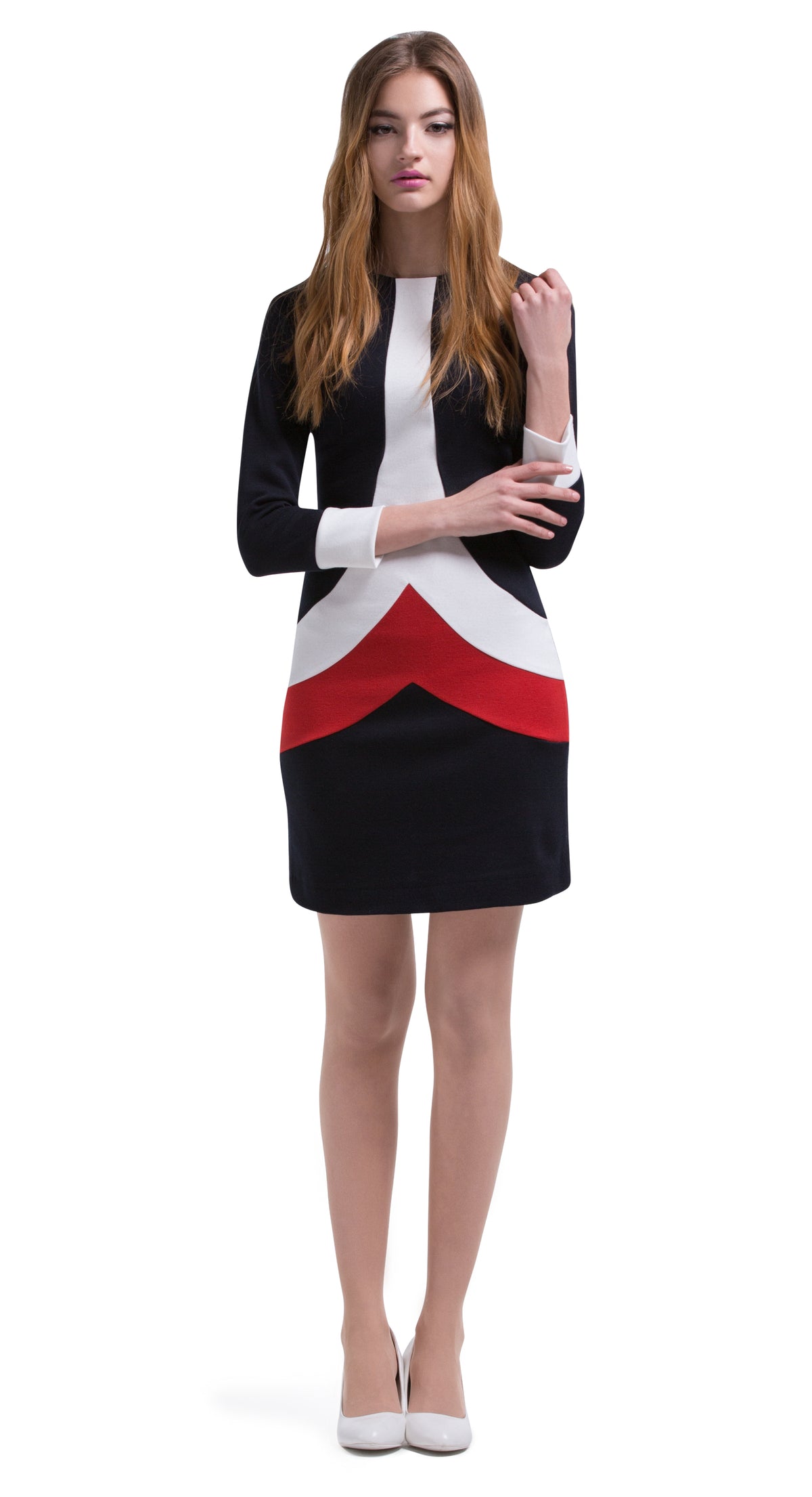 This Autumn, long sleeve Italian jersey straight cut dress delivers an immediate sixties retro impression through use of the chevron bodice panels creating a unique tric-olour stripe. Back zipper closure, full length sleeve with white cuff detailing. Generous stretch within the jersey; a comfortable dress without surrendering impacting style.