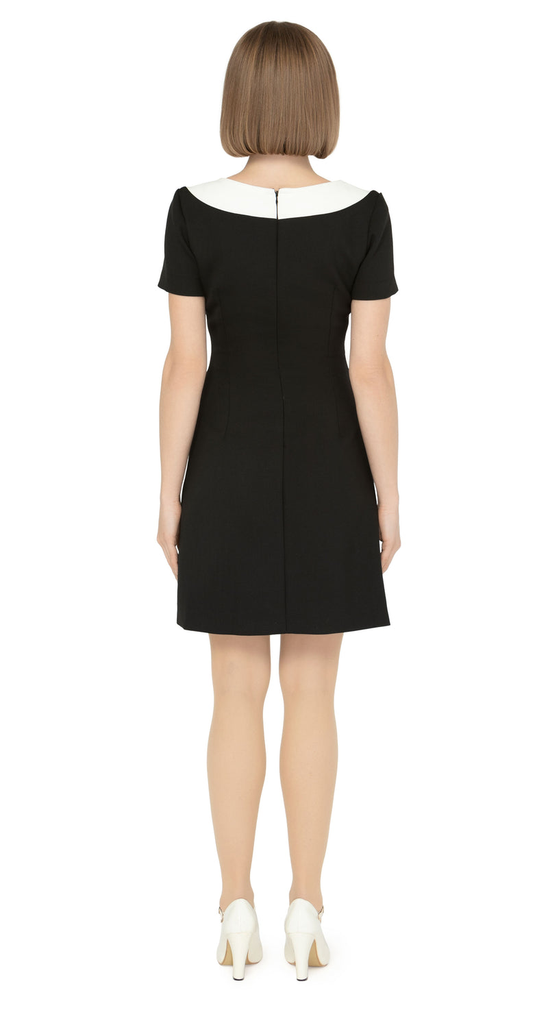 Beyond a fitted Little Black Dress (a must-have for any wardrobe), our contrasting white dramatic neckline adds a touch of sophistication, while the imaginative creative detailing through decorative button placement and button-down essentials pockets makes for a very wearable and functional look. With a slightly A-lined skirt and short sleeves, this dress proves flattering on all figures.